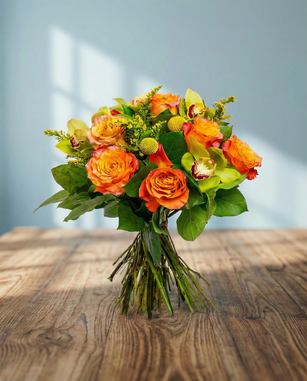 Rose Ecuador Free Spirit Orange, Sulidago, Ruscus green Single, Craspedia.